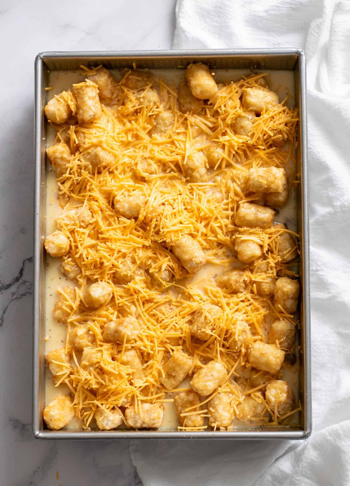shredded cheese and egg mixture in the pan