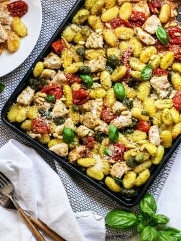 Sheet pan full of chicken, gnocchi, and vegetables