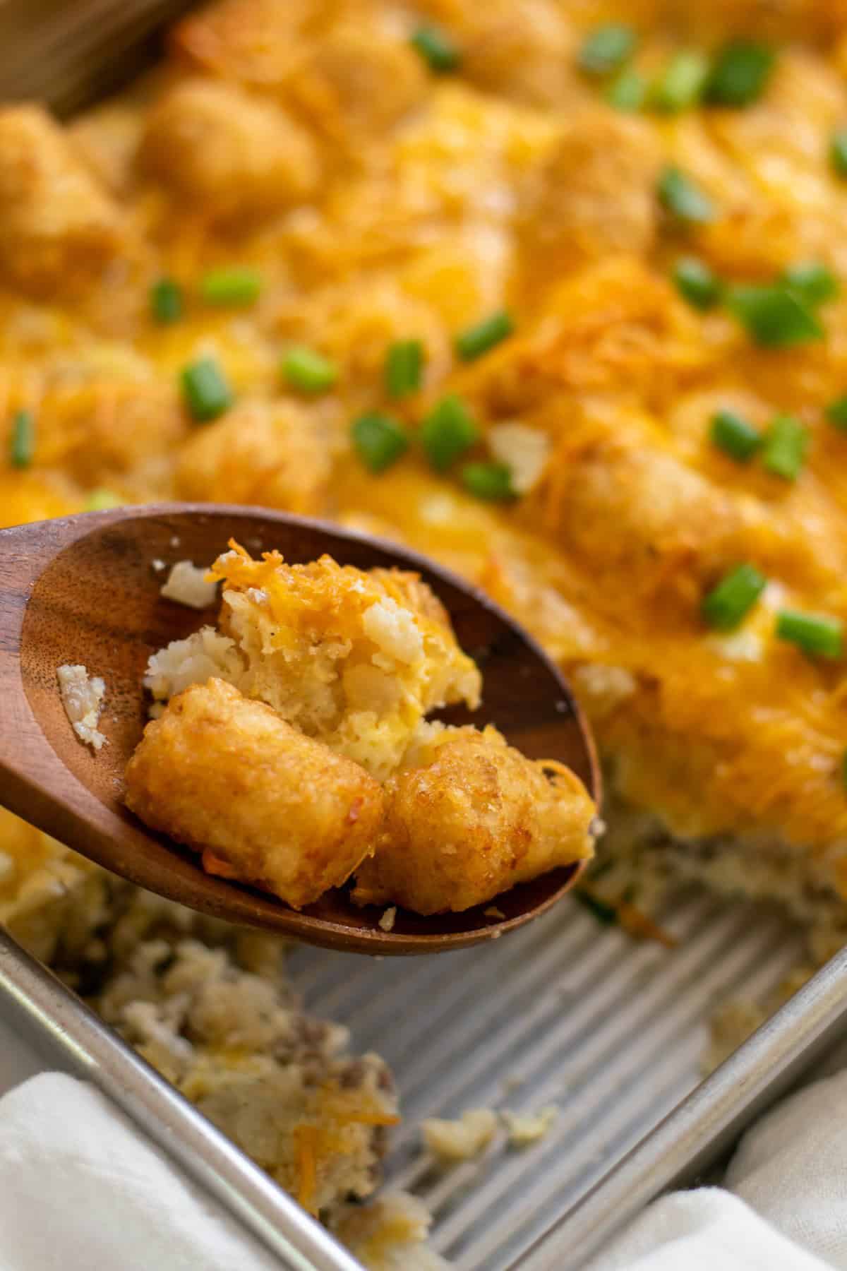crispy tater tots in a wood spoon